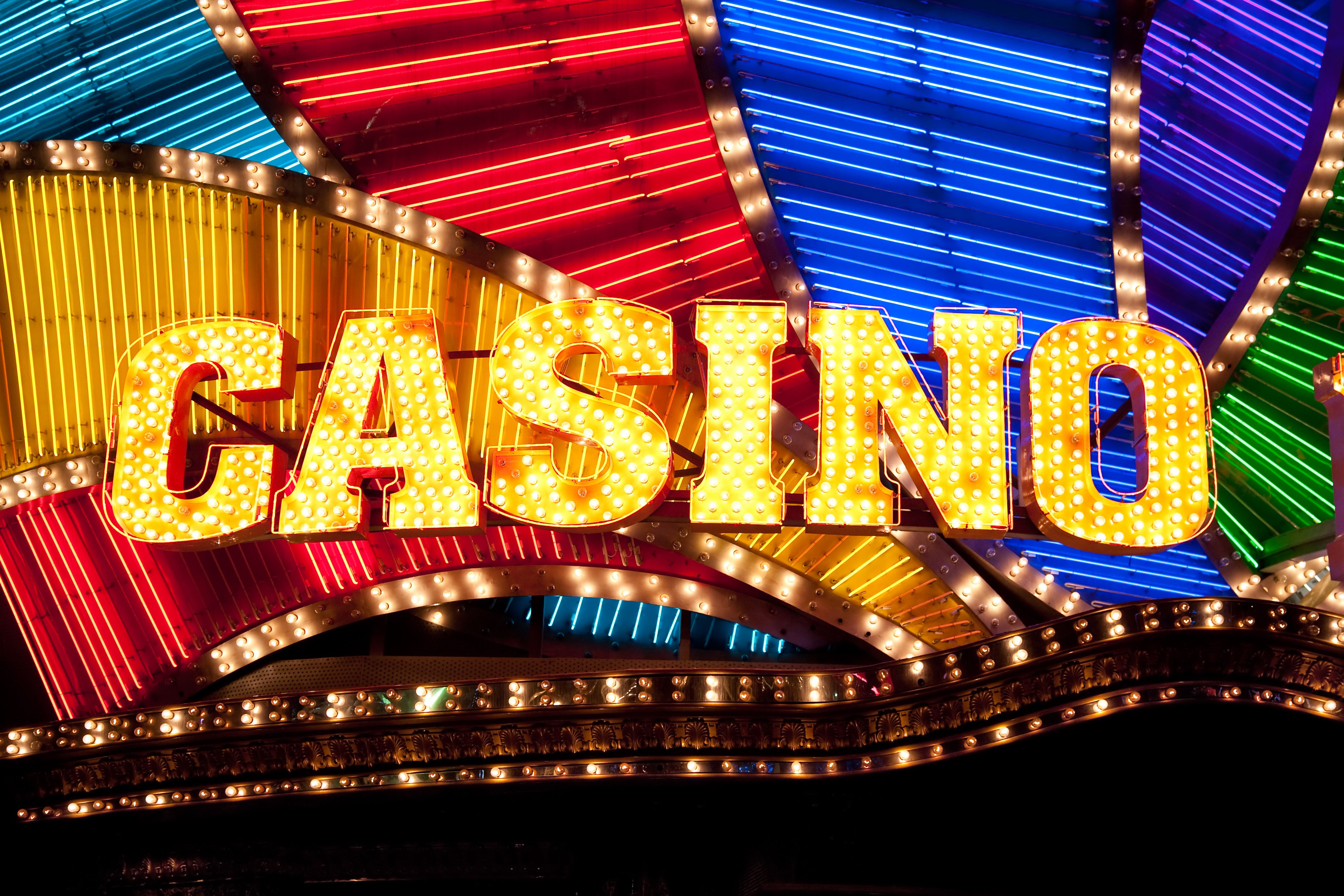 A sleek graphic showing a professional live dealer at a blackjack table, with a digital interface overlay.